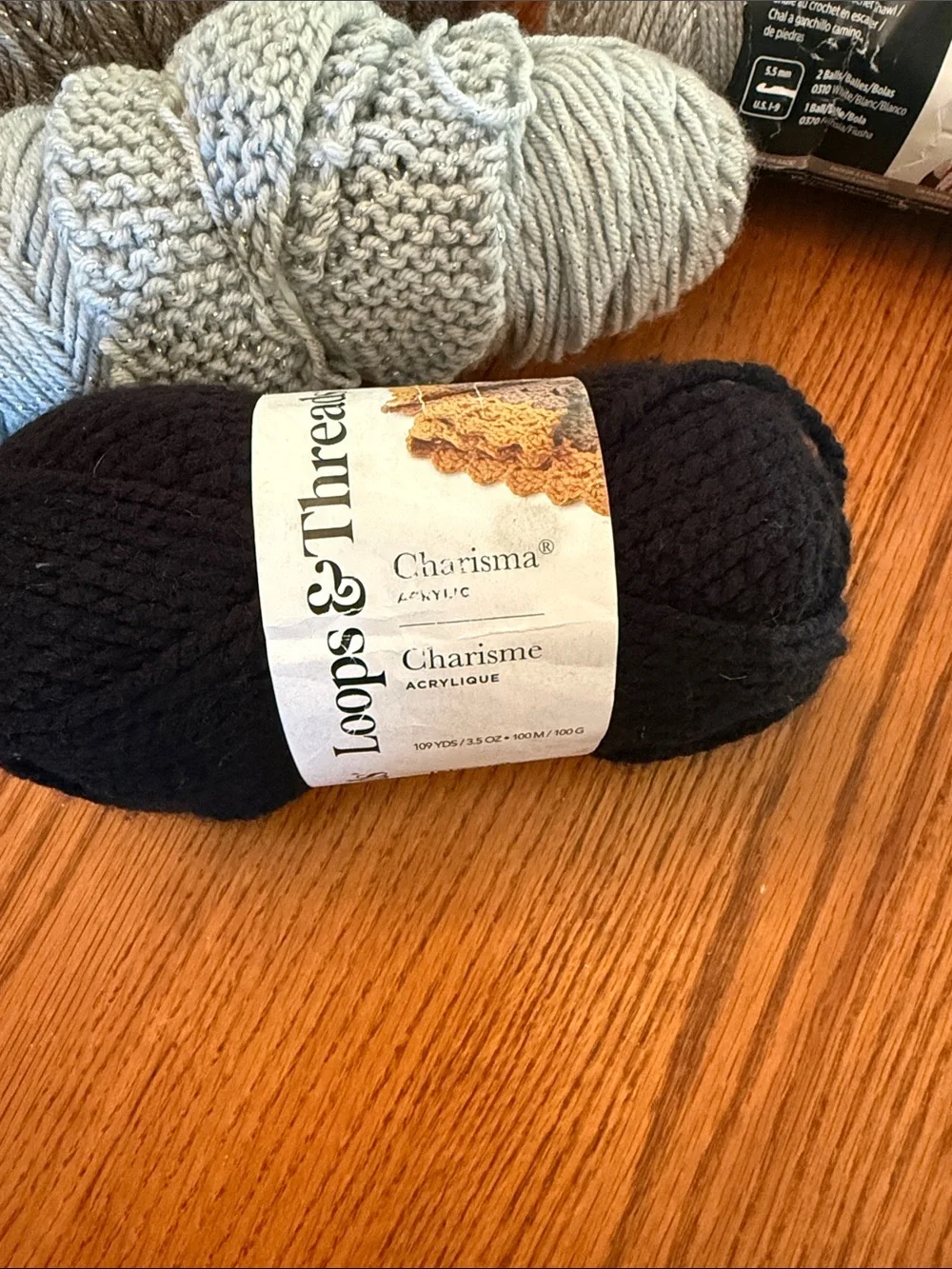 Super Saver Yarn Bundle in Purple, Black, white, gray metallic, and brown.